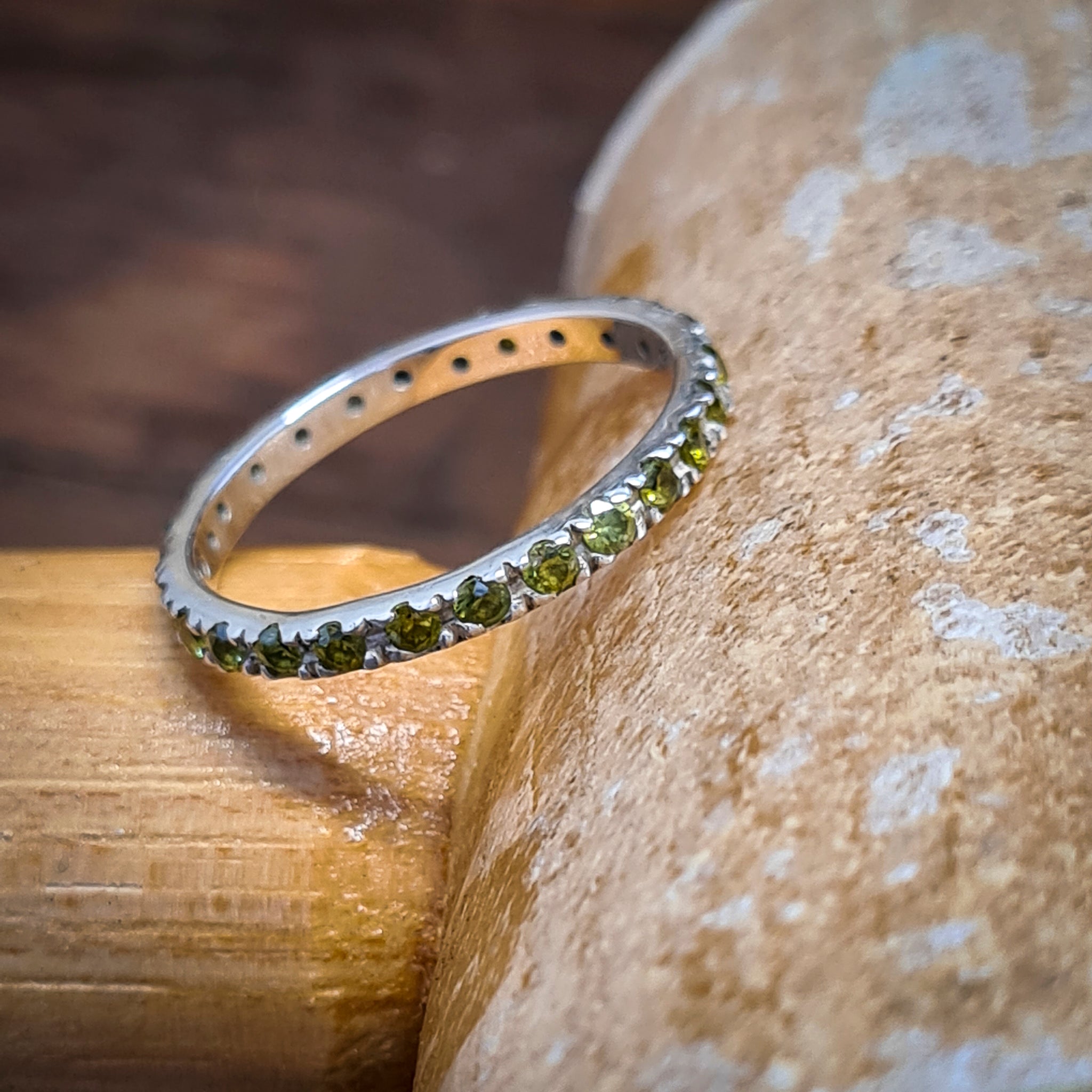 Eternity ring green stones